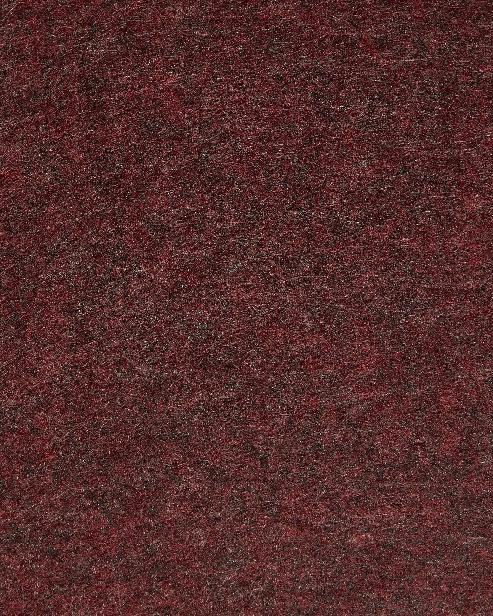Primo piano di WoodUpp Vigg | Felt Box / BM2 in ox red, che mette in risalto il feltro acustico testurizzato con sfumature delicate e fibre visibili.